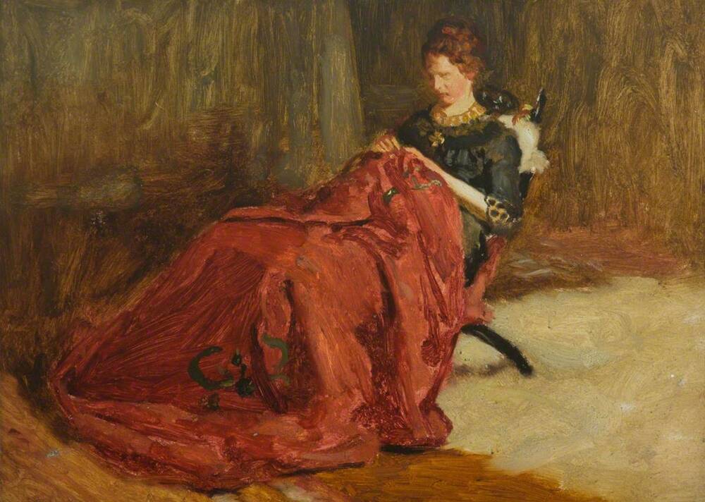An oil painting of a woman sitting on a wooden chair in an interior. She wears a green dress, and is embroidering a large red cloth which covers her legs.