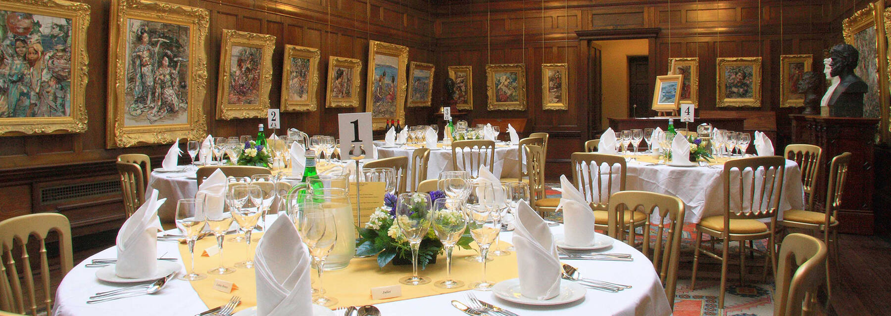 Broughton House gallery with round wedding dining tables arranged in the centre of the room