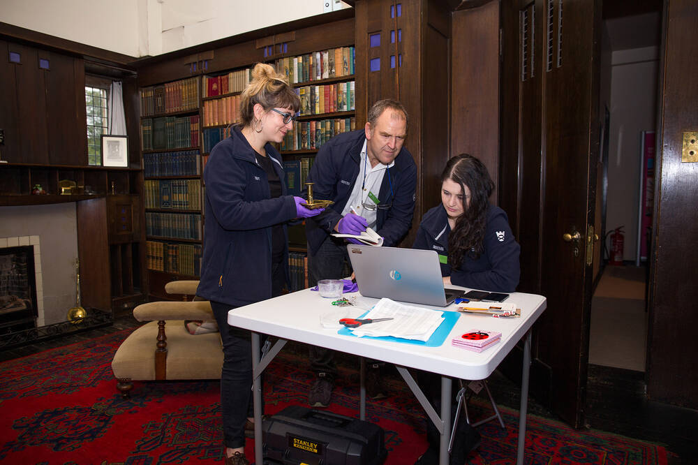 Brian, Silvia and Demi working in the Library at the Hill House