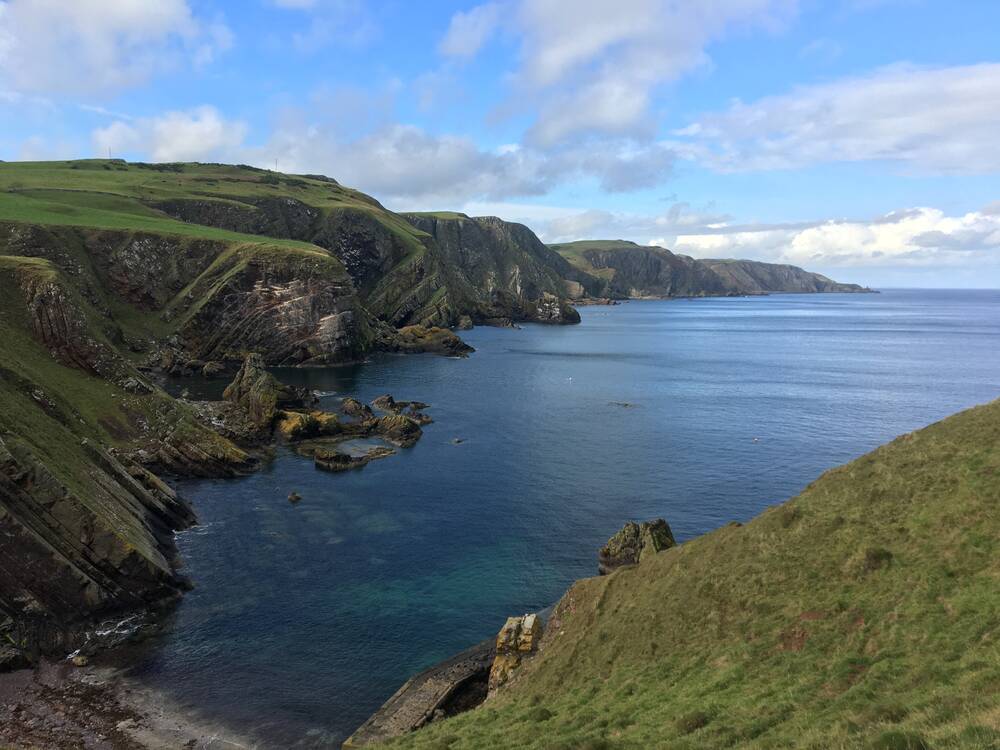 A view of the coastline at St Abb’s Head, with the sea coming in between the cliffs.