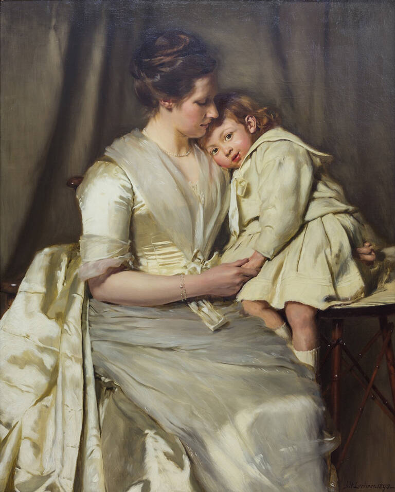 A portrait of a seated young woman, who is cuddling her young son who is perched on a tall stool. Both wear cream formal clothes.