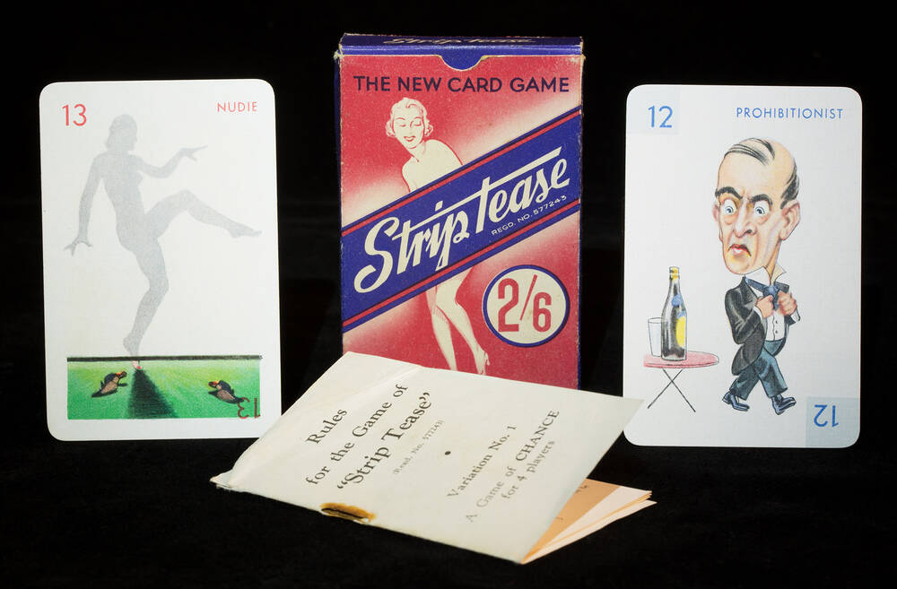 A deck of cards (with rules lying in front) for the whist-style game ‘Striptease’. On either side of the box are a playing card with illustrations: on the left is a silhouette of a naked woman; on the right is a man frowning at a bottle of wine.