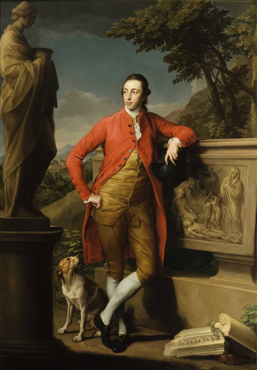 A portrait of a young well-to-do man, who stands against a classical backdrop with a dog sitting at his feet. He wears a three-quarter red coat and has his legs crossed in an informal style.