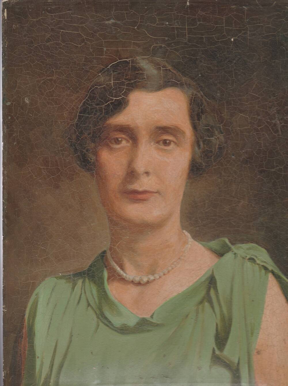 A painting of a young woman in the 1920s. She wears a sleeveless green dress and has  short brown hair. The painting surface has cracked a little over the years.
