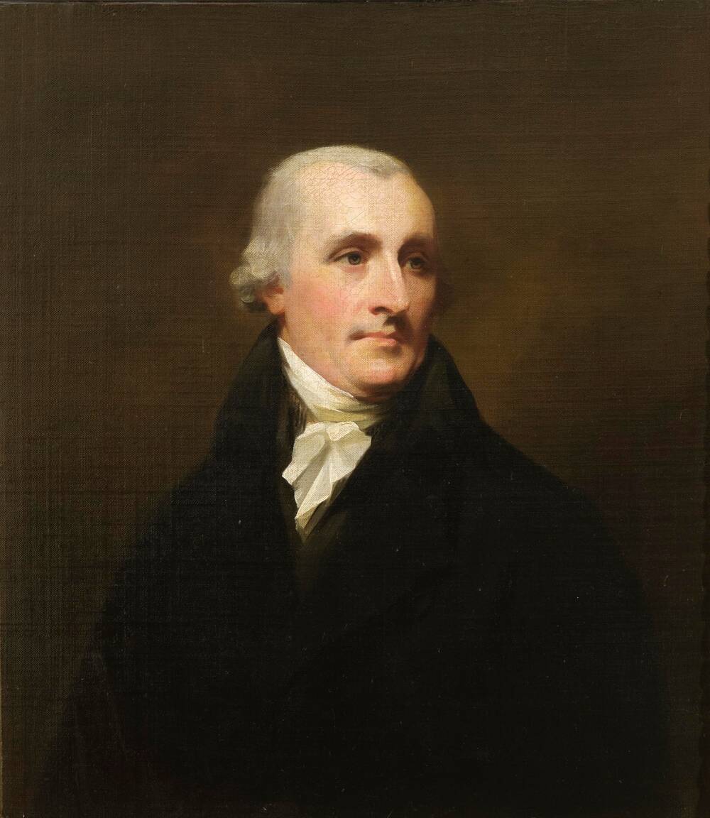An oil painting of the top half of a middle-aged Georgian man. He wears a dark coat with a high collar and a white cravat around his neck. He has short grey hair.