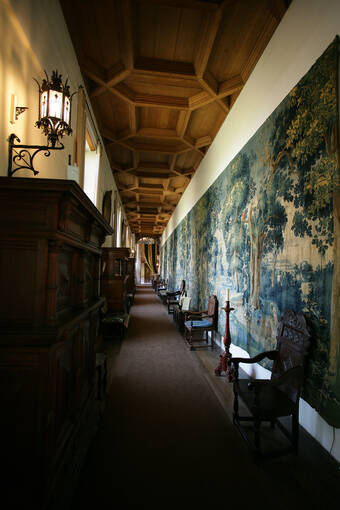A large tapestry runs along the impressive Tapestry Corridor in Falkland Palace