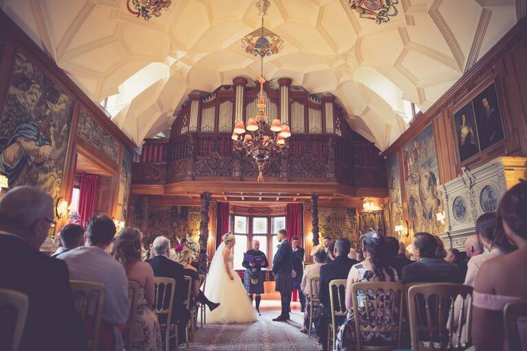 A wedding ceremony in the Gallery at Fyvie Castle