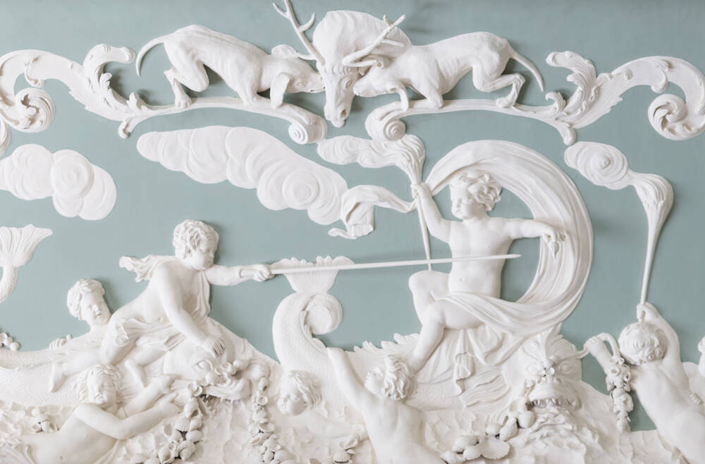 A close-up of the plasterwork at House of Dun. This scene shows several cupid figures, two hounds and a stag.
