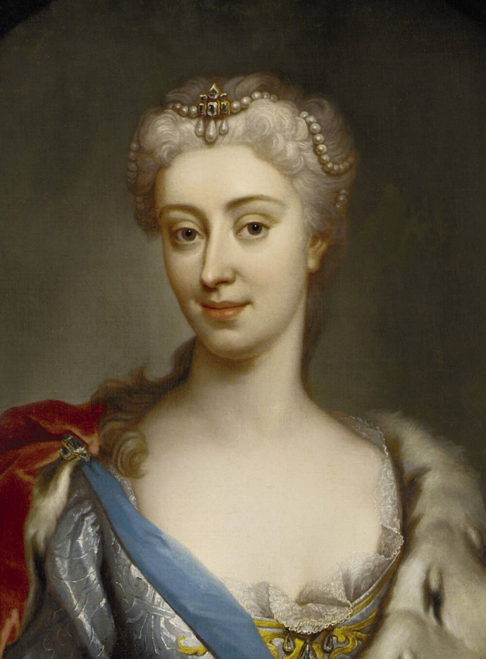 A half portrait of a young, very rich 18th-century woman. Her hair is neatly tied back and adorned with a pearl headband. She wears a low-cut silk dress with a fur-lined cape around her shoulders, attached to a blue sash.