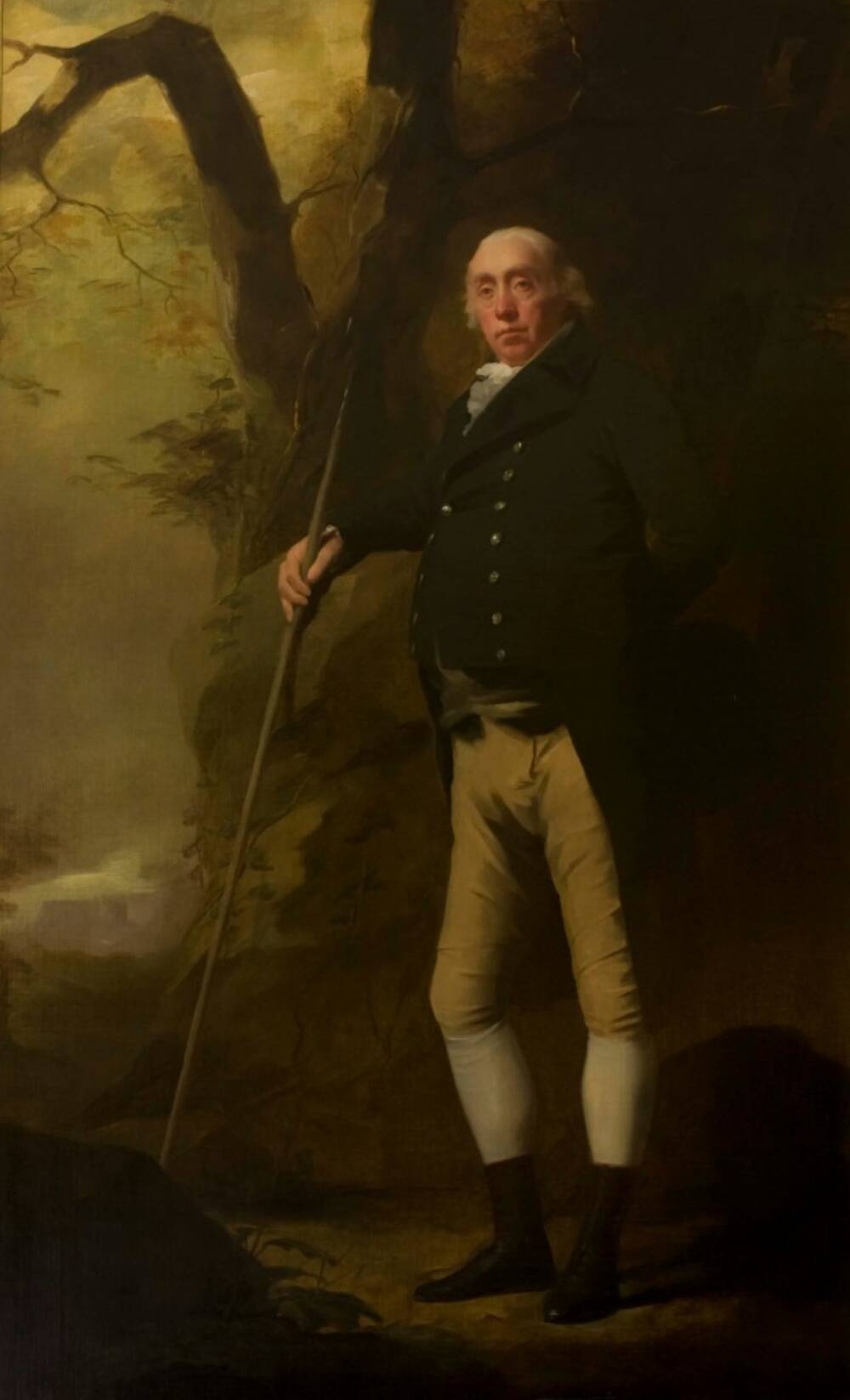 A portrait of a Georgian gentleman dressed formally, standing at the edge of woods and holding a long staff.