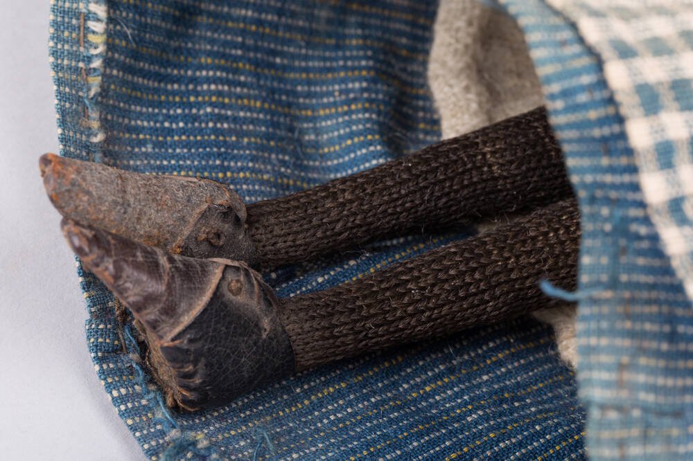 Detail of shoes and woollen stockings