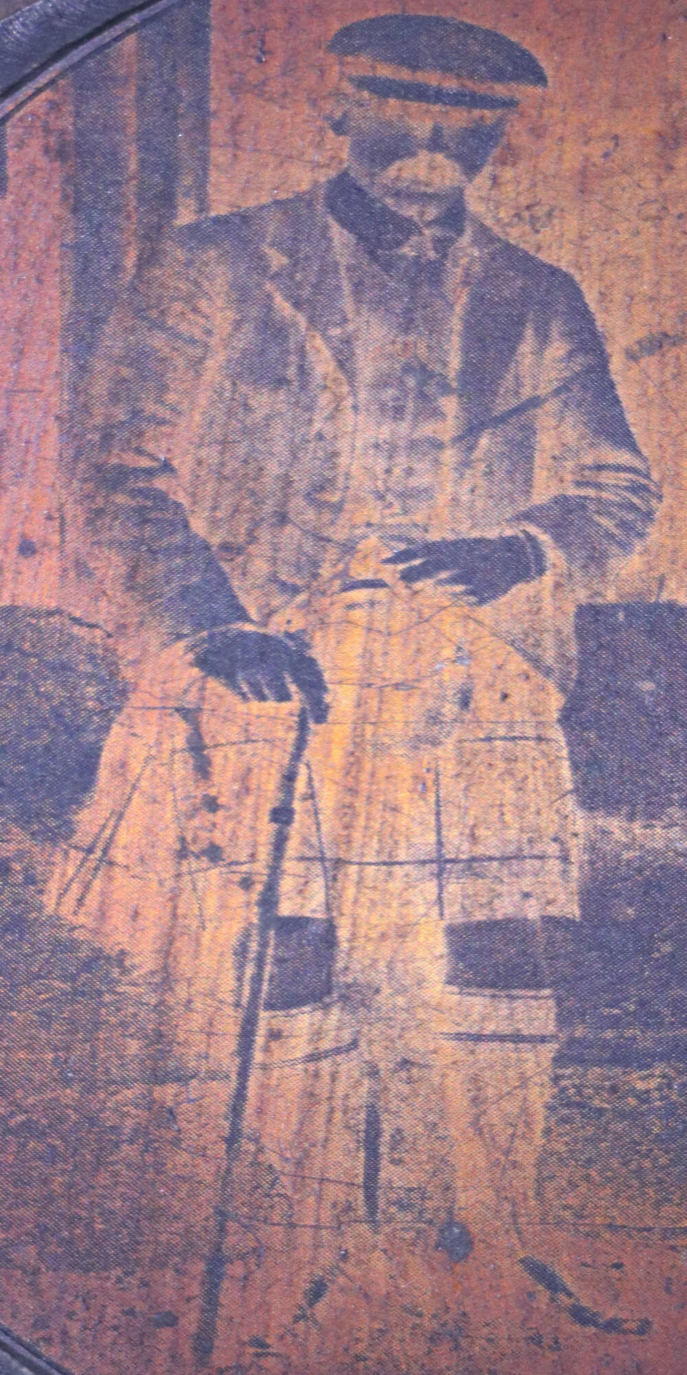 Negative image of a kilted man, holding a walking stick