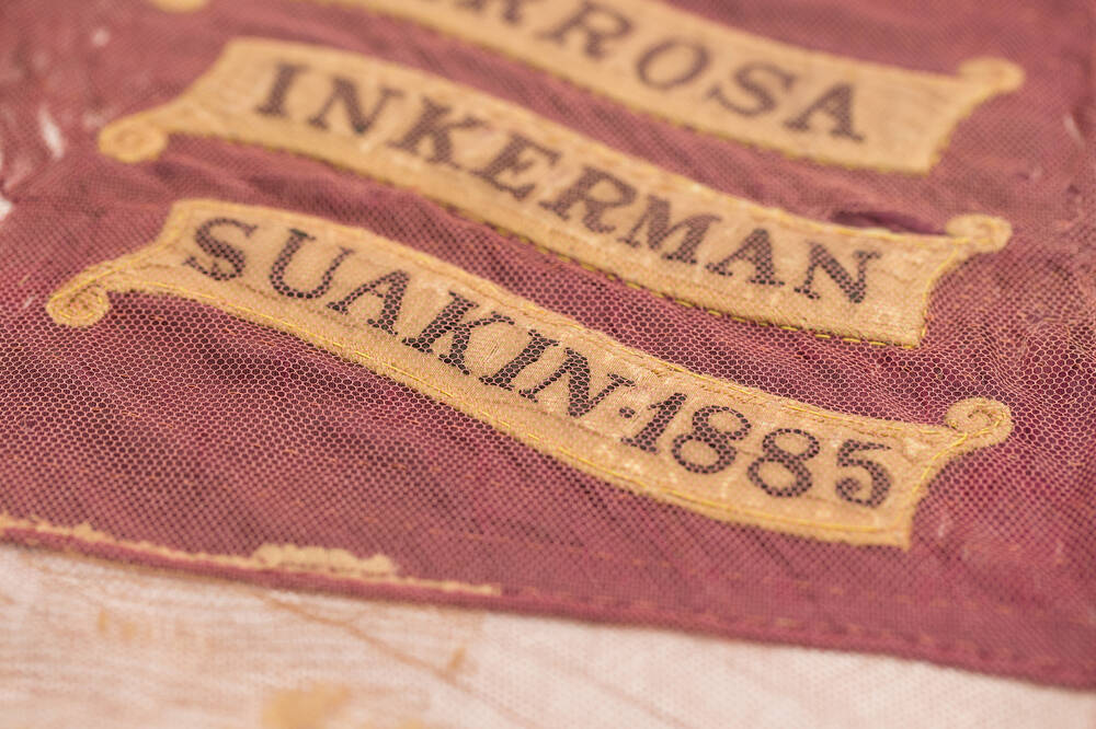 Close-up showing stitching and battle name 