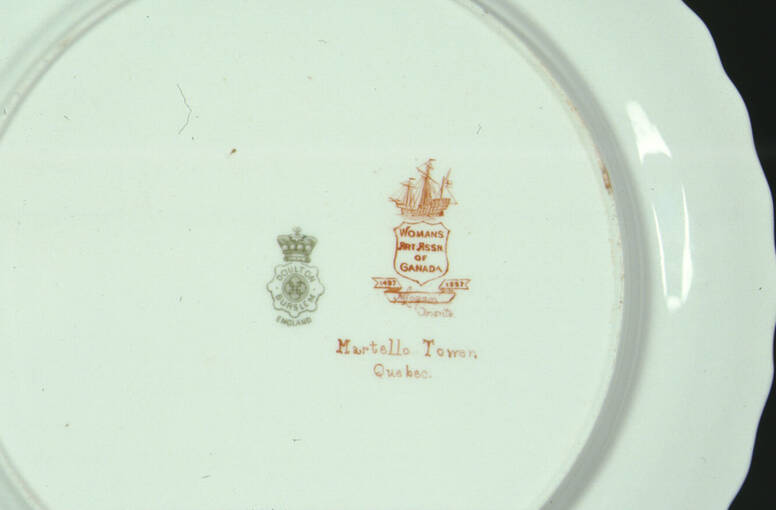 Reverse of a plate with two stamps on it