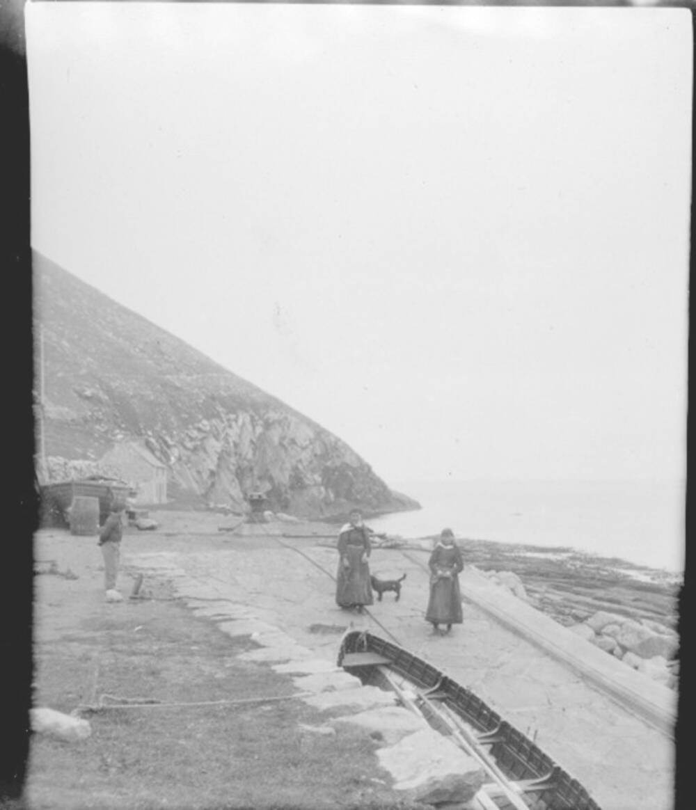 Black and white image of two women on the jetty on Hirta, St Kilda.