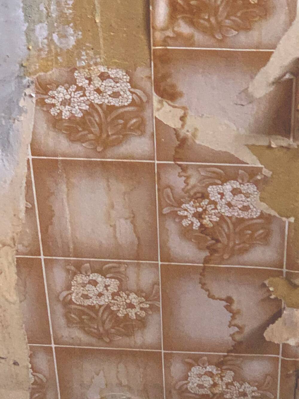 Patterned wallpaper uncovered on a wall at Gladstone's Land.